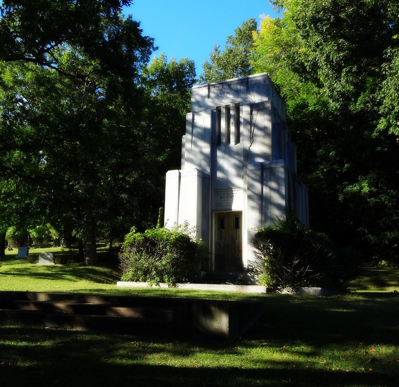 Art deco building facade features and design lessons for today image cemetery, art deco, mausoleum, deco, design, old, decoration, retro, park, vintage, architecture, gothic, antique, entrance, door, building, stone, facade, exterior, structure, religion, entry, mystery, graveyard, doorway, religious, mysterious, historic, spiritual, portal, historical, tomb, tombstone, church, monument, outdoors, grave, gravestone, christianity, symbol, christian, burial, headstone, dead, buried, nature, funeral, memory, history, landmark, sky, grass, weathered, marker, landscape, scary, spooky, granite, grey, memorial, trees, gray, horror, rest, peace, architectural, style, day, daytime, greenery, bronze, memoriam, beautiful, impressive, resting place
