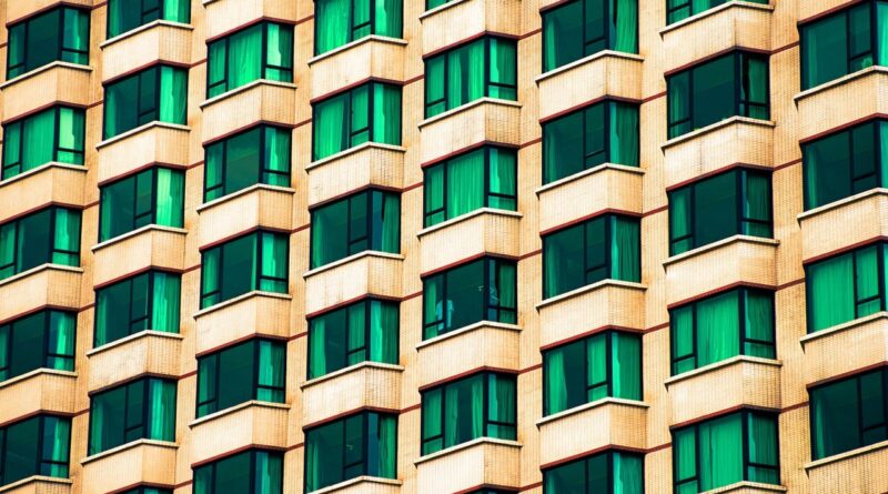 architecture, windows, modern, city, building window, glass panes, urban landscape, geometric pattern, symmetry, grid pattern, yellow, green, concrete structure, high-rise, office building, urban style, architectural design, repetitive pattern, urban architecture