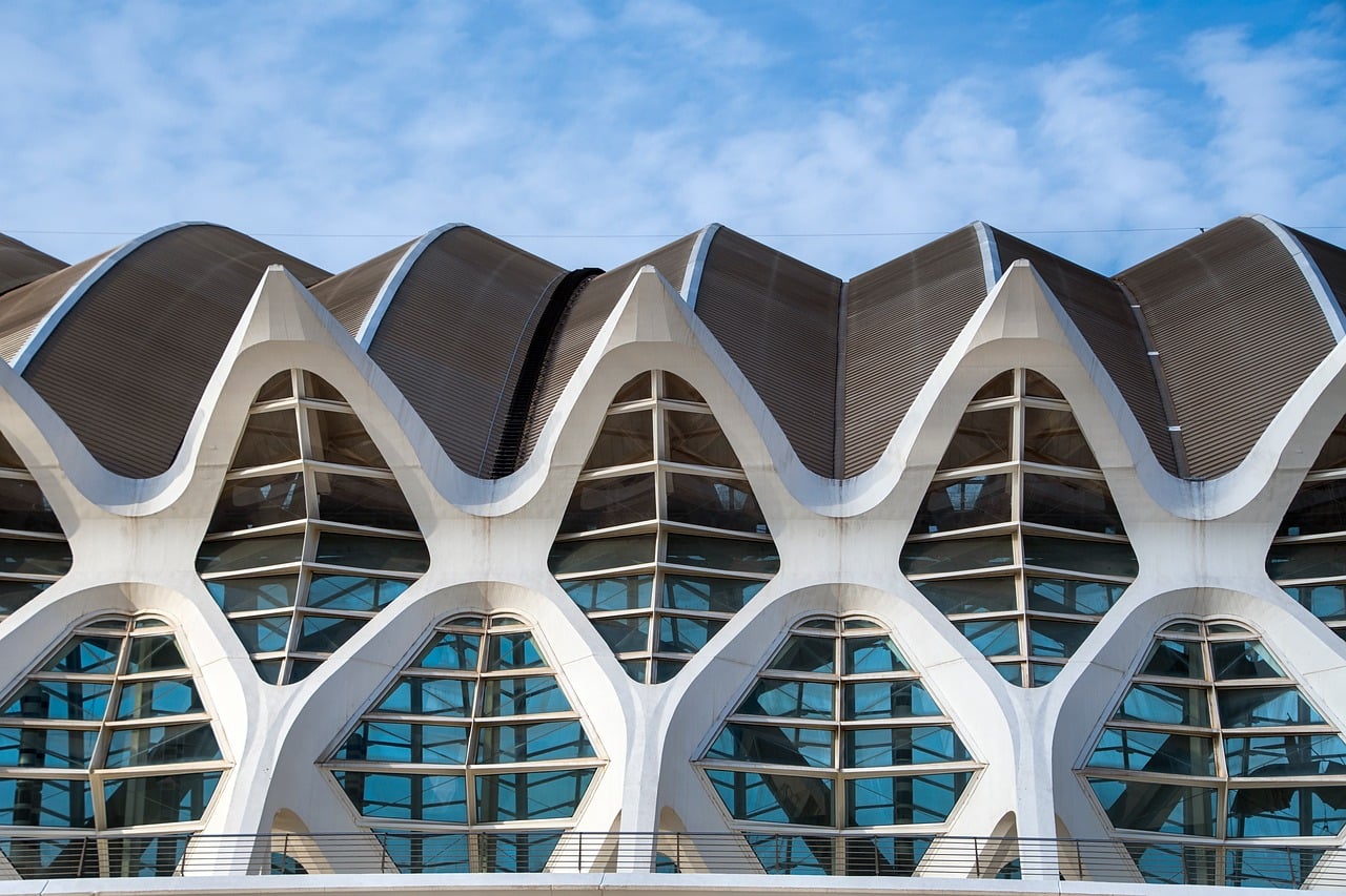 Mixed use building facade design strategies for complex urban projects image architecture, modern, symmetry, building, city, museum, valencia, urban, exterior, clouds, blue sky, texture, nature, geometric, futuristic, windows, arch, architectural design, construction, modern architecture, creative design